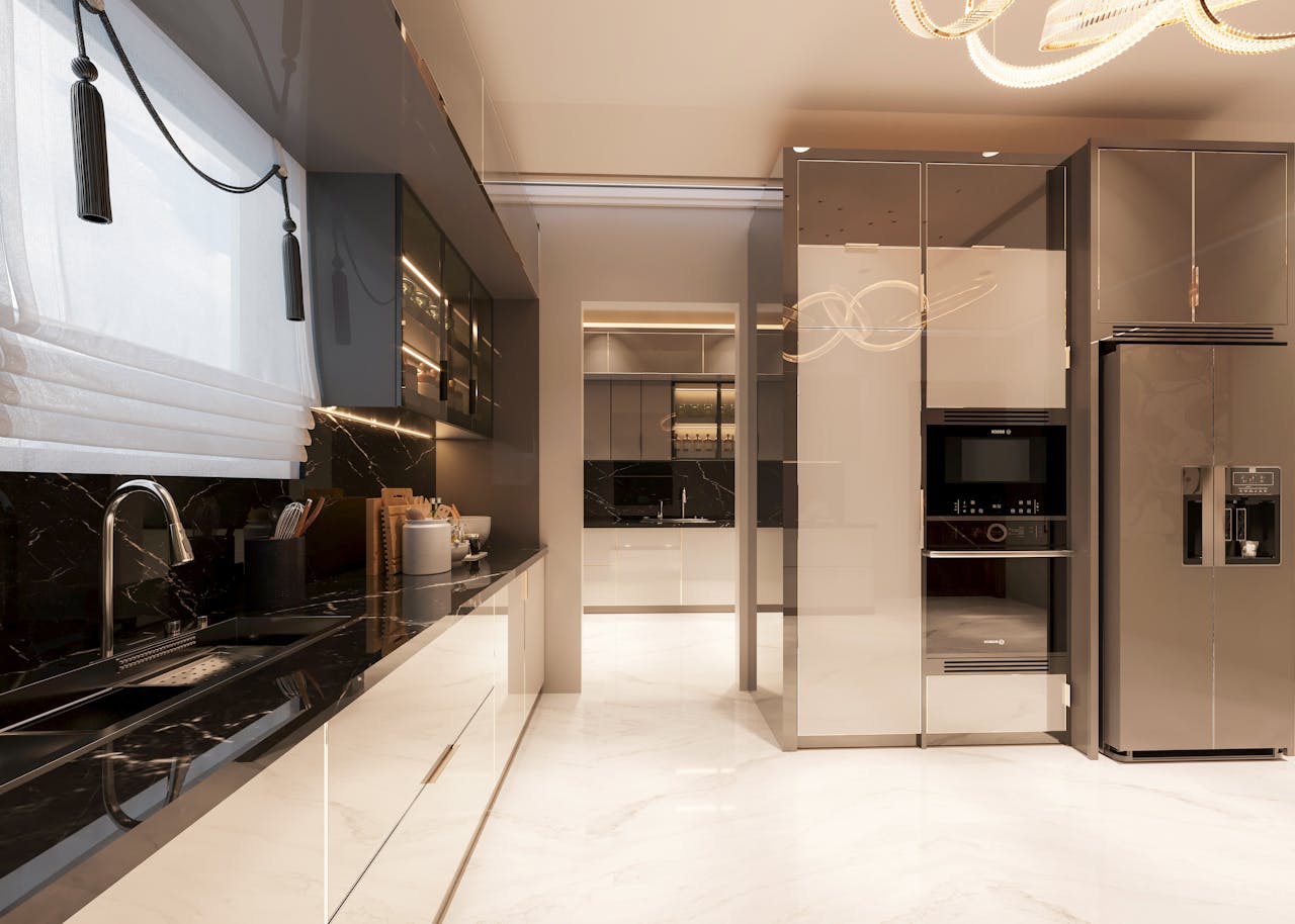 gallery-6 Contemporary kitchen with sleek marble countertops, modern appliances, and elegant lighting.